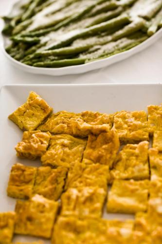 two pictures of a plate of food and a plate of asparagus at Hotel Apollo in Cesenatico