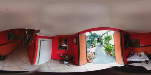 an overhead view of a room with red walls at Hotel Il Granaio in Porto Mantovano