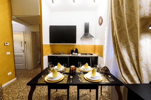 a kitchen with a table with dishes on it at Palazzo del Sale, Rialto in Venice