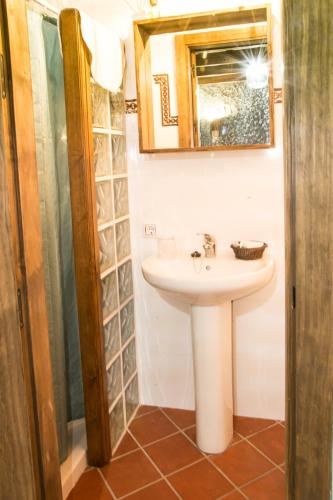 a bathroom with a sink and a mirror at Casa Mirador San Pedro in Arcos de la Frontera