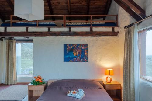 Postel nebo postele na pokoji v ubytování Hotel Tambopaxi