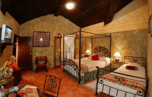 Postel nebo postele na pokoji v ubytování Hotel Palacio de Doña Beatriz