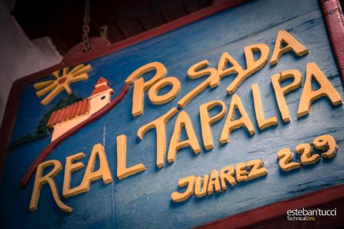 a sign for a real marina with a jumeirah at Hotel Posada Real Tapalpa in Tapalpa