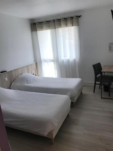 Кровать или кровати в номере Hotel de la Bonnheure