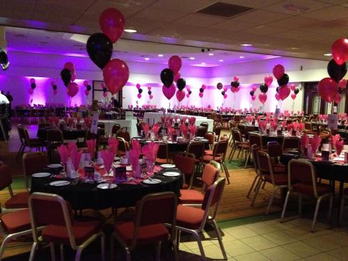a room filled with tables and chairs with pink balloons at Best Western Ipswich Hotel in Ipswich