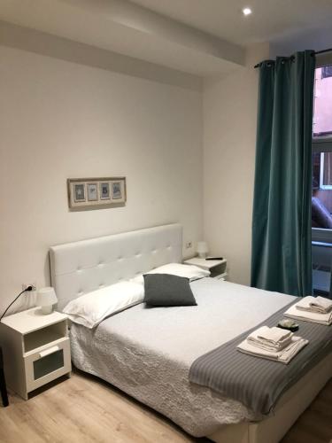 Ένα ή περισσότερα κρεβάτια σε δωμάτιο στο Spazio Cavour Guesthouse