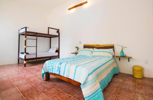 a bedroom with a bed and a bunk bed at Casa Pancho Playa in San Francisco