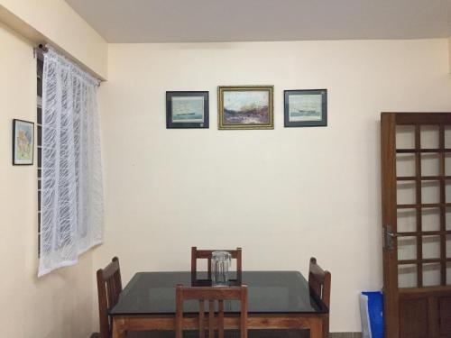a dining room with a table and chairs at Ki Kiba Dhee in Darjeeling