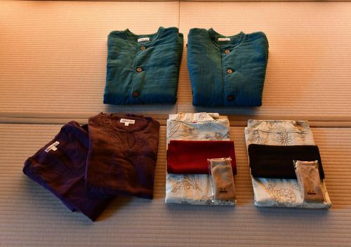 a group of five different types of pants on a wall at Balinese onsen ryokan Hakone Airu in Hakone