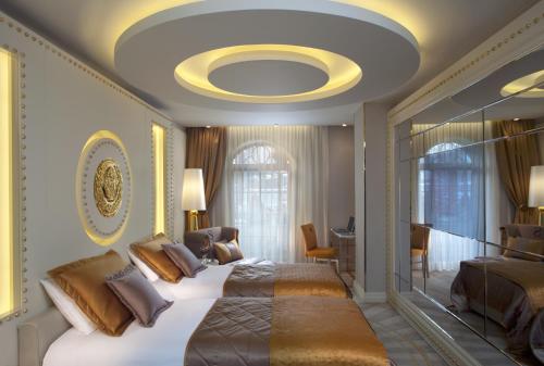 A bed or beds in a room at Sura Design Hotel & Suites