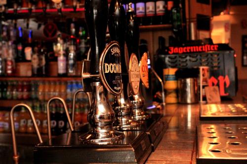 a bar counter with a drink dispenser on it at The Crown at Wells, Somerset in Wells