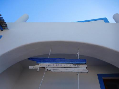 a sign hanging from the ceiling of a building at Da Nino sul mare Filicudi in Filicudi