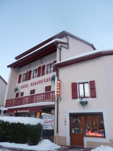 a building with a sign that reads hotel berzerker at Hotel Le Beauregard in Divonne-les-Bains