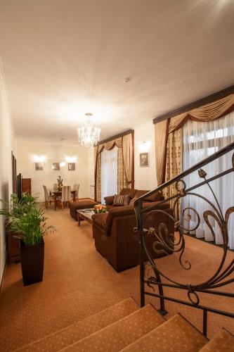 a living room with a couch and a table at Park-Hotel Kidev in Chubynske