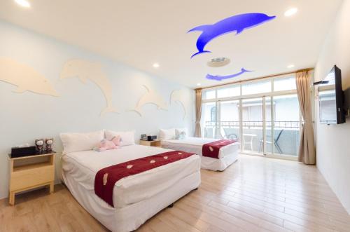Giường trong phòng chung tại YOYO 11 House