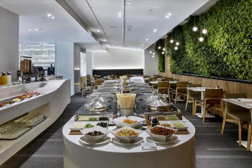 a long buffet line of food at a restaurant at The Carlton Taichung in Taichung