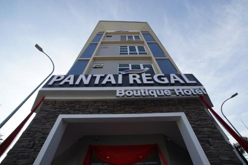 a building with a sign that reads central retail boutique house at Pantai Regal Boutique Hotel in Kuantan