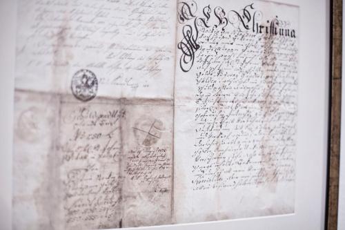 a document with handwriting on the side of a wall at Das gemütliche Dorfhotel Kaltenhauser in Hollersbach im Pinzgau