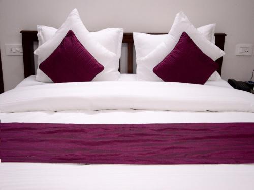 Postel nebo postele na pokoji v ubytování Hotel Sukhvilas