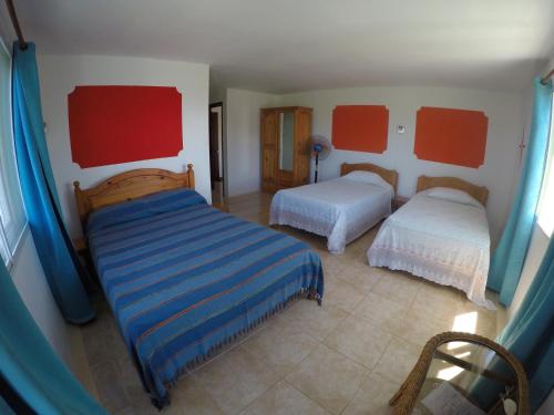 Postel nebo postele na pokoji v ubytování Tibambari