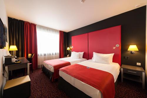 Cama o camas de una habitación en Avenue Park Hotel