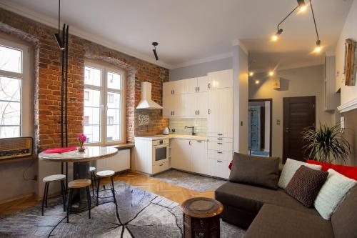 a living room with a couch and a table at Locum Elżbieta - Old Town - Wroclaw in Wrocław