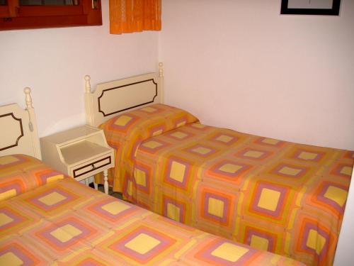 Tempat tidur dalam kamar di Nettuno 53