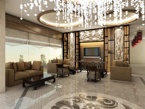 a rendering of a living room with a chandelier at Graf Victor Hotel in Alanya
