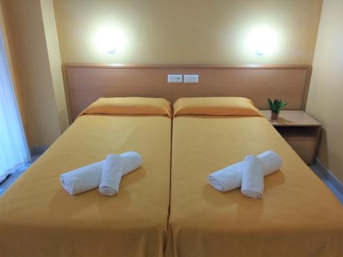 Letto o letti in una camera di Hotel Delicias