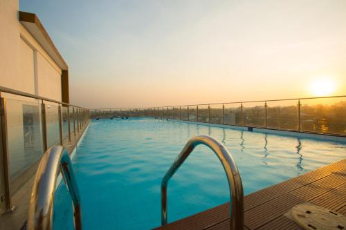 a large swimming pool on top of a building at Shalom Residence Nawala in Colombo