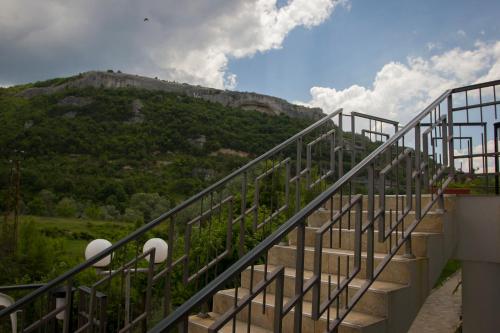 a staircase with a view of a mountain at Complex Perpera in Stambolovo