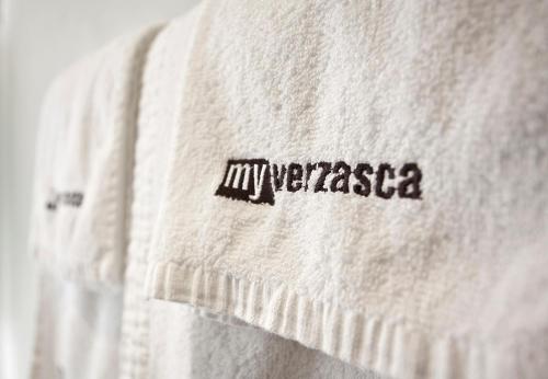 a white sweater with the word superstar written on it at MyVerzasca Resort Casa Rossa in Brione
