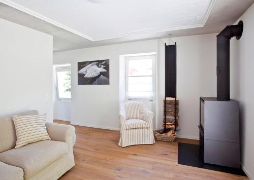 a living room with a couch and a fireplace at MyVerzasca Resort Casa Rossa in Brione