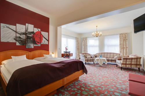 Postel nebo postele na pokoji v ubytování INA Hotel Consul