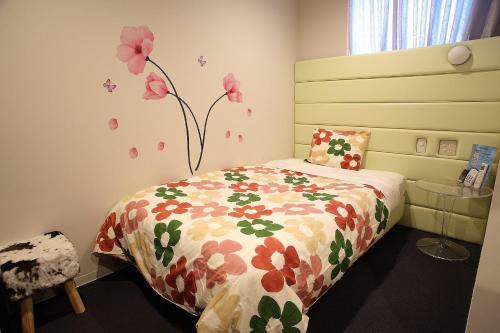 Ένα ή περισσότερα κρεβάτια σε δωμάτιο στο Hotel Iwaki