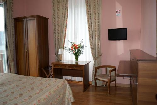 Ένα ή περισσότερα κρεβάτια σε δωμάτιο στο Hotel La Giara