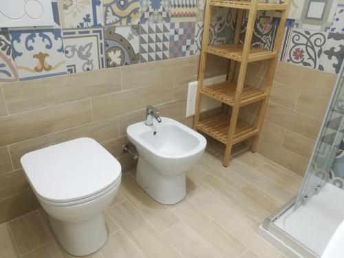 a bathroom with a toilet and a sink at B&B Laura e Chiara in Trapani