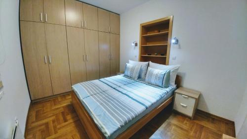 Postel nebo postele na pokoji v ubytování Apartment Harmonija