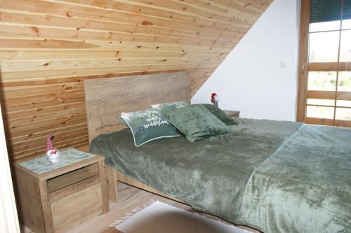 En eller flere senge i et værelse på Lavender Cottage