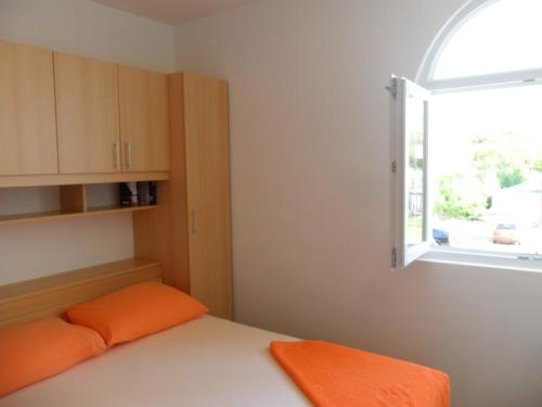 Postel nebo postele na pokoji v ubytování Apartmani Tomičić