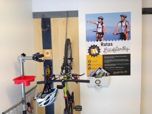 a wall with a bunch of ski equipment on it at Tierra de Biescas in Biescas
