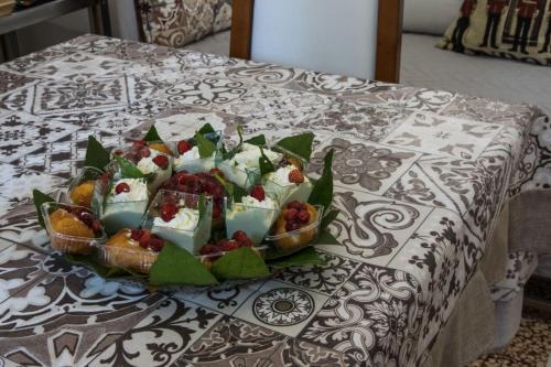 a tray of food on top of a table at Penisola Apartment in Vico Equense