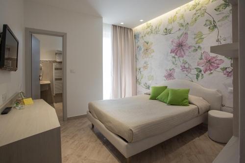 Postel nebo postele na pokoji v ubytování Hotel Principe