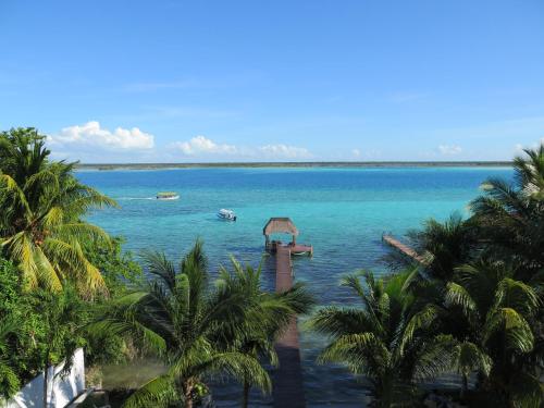 a view of a body of water with boats in it at Amigos Hotelito in Bacalar