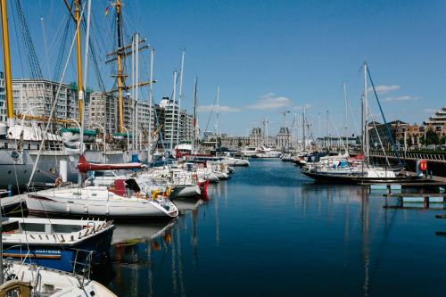 a bunch of boats are docked in a marina at Hotel Prado in Ostend
