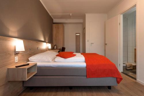Ένα ή περισσότερα κρεβάτια σε δωμάτιο στο Hotel Bergrust