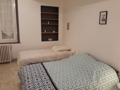 Posteľ alebo postele v izbe v ubytovaní La maison d'Eléonore