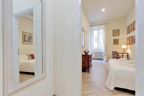 Una cama o camas en una habitación de Sistina 2