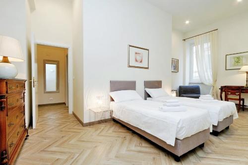 Una cama o camas en una habitación de Sistina 2