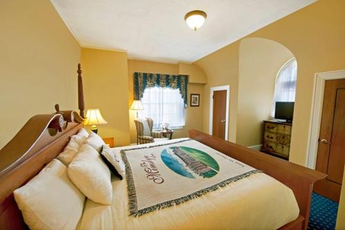 a bedroom with a large bed in a room at The Mimslyn Inn in Luray